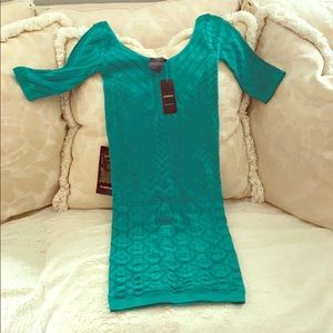 Bebe dress with 3/4” sleeves. New with tags.